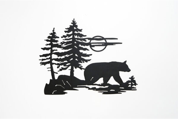 Bear walking away from bush