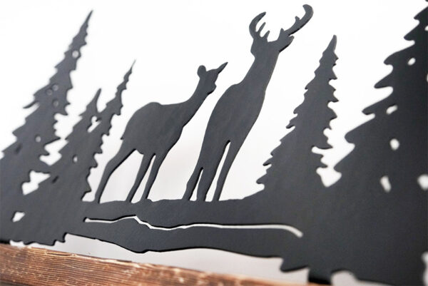 Deer with pines long one on wood