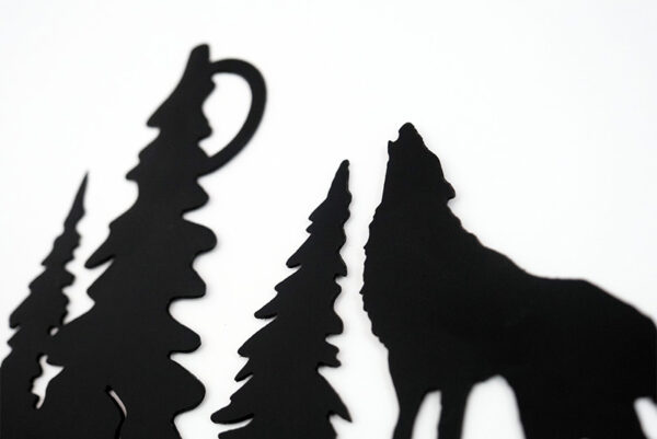 Large wolf howling in the moon