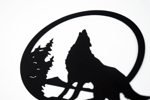 Wolf howling in the moon